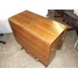 Gateleg table with cupboard. 30 inches wide , 15 closed 73 fully extended.