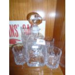 A set of 6 Cut glass whiskey tumblers and a heavy whiskey decanter.