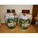 Pair of Ovid vases decorated with trees and flowers.