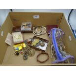 Assorted box of costume jewellery, pin badges, pendants etc