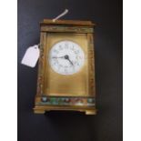 French Brass Carriage Clock with enamelled panels on body and handle. White enamelled dial. 5 inches