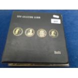 A Boots coin collector album with approx. 29 Crowns, 52 2/6 or 2/-