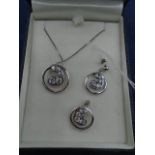 A boxed ? Silver stamped 925 matching pendant and pierced ear rings with white stone 11grams
