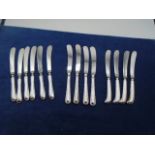 Set of silver handled butter knives plus 2 other sets of 4
