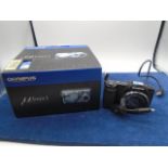 Olympus 300 digital boxed Plus a digital Olympus stylus with cable.