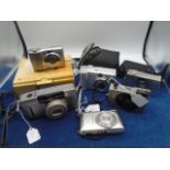 Canon IXUS II and one other Plus a Canon Z115 Caption and a Canon power shot a95 in case, and a