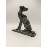 A modern bronze depicting a lurch dog looking back signed B.C., 8 1/2" tall