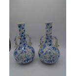 Pair of blue and white vases with handles