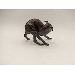 A bronze of a playing greyhound/long dog 3 1/2" tall signed RHC