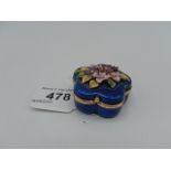Enamelled pill box with flowers on top
