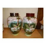 Pair of Ovid vases decorated with trees and flowers.