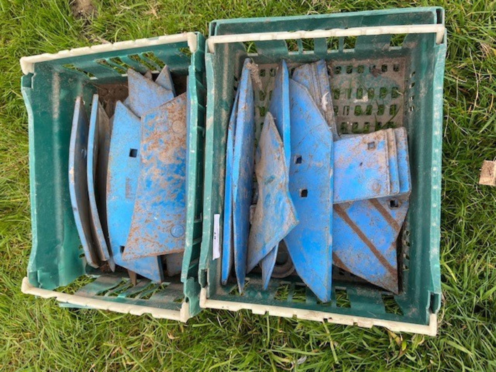 A box of plough points/parts (unused)