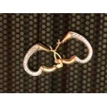 9 ct heart earrings. .39 grams