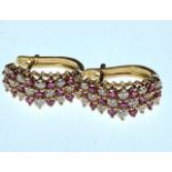 A pair of 9ct gold garnet and diamond earrings