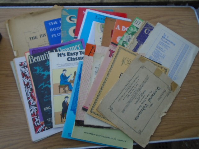 Collection of vintage sheet music and piano booklets