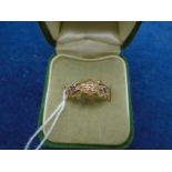 18ct gold boxed dress ring with scroll work and 6 milk white stones, 2.9gms gross