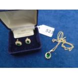 Dress set with emerald crystal stone of pair of stud earrings and pendant on chain