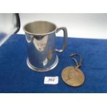 Heraldic pewter tankard and Crane Co 75th anniversary (1855-1930) medallion