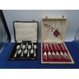 Box of silver plated spoons and boxed Angora silver plated cake knife and forks