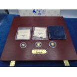 History of our monarchy wooden box with 3 small gold coins featuring Queen Victoria, Elizabeth II