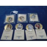 7 individual Diamond Jubilee gold plated photo coins with certificates of authenticity