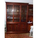 3 Door Glazed Bookcase with cupboards / drawers below 79 inches tall 56 wide 17 deep