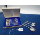 A boxed set of six Norwegian silver teaspoons by Mylius each handle having floral scrolled and