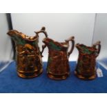 Set of 3 graduated Victorian copper lustre jugs, approx 21cm, 18cm and 16cm tall