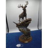 Joseph Hautman's 'Whitetail Majesty' cold-cast bronze illuminated sculpture of a stag on a rocky