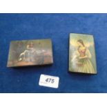 2 antique rectangular papier mache snuff boxes, one featuring a lady picking flowers and the other a