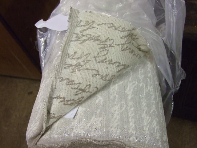 Roll of Approx 44 metres Script Material cream with glitter writing ( VAT will be added to hammer - Image 2 of 3