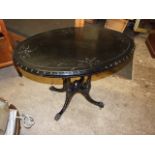 Ebonised Oval Antique Table on porcelain castors 36 x 22 1/2 inches 27 tall