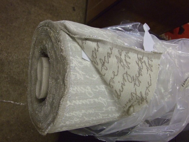 Roll of Approx 44 metres Script Material cream with glitter writing ( VAT will be added to hammer