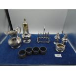 Plated cruet set, toast rack, milk jug, sugar sifter plus tudric style napkin rings