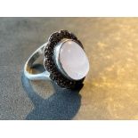 A silver opal and white stone set ring, L total weight 5.5g