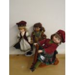 3 porcelain dolls in national costumes incl Scottish and North American plus scooter