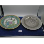 A Japanese display plate with birds and green enamel and a Wedgwood Etruria silver coloured plate,