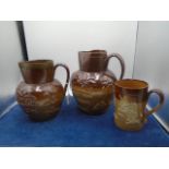 2 Royal Doulton Lambeth Harvest jugs, 23cm and 20cm tall (small chip to rim on largest) plus Lambeth
