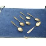6 White Metal Teaspoons stamped 21 and 90