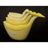 Set four early plastic Swan shape measuring cups