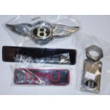 Four various Bentley car badges