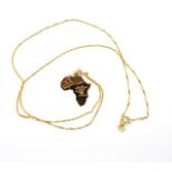 African pendant on 9ct gold chain