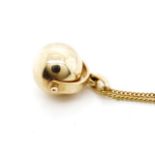 Yellow gold spinner pendant