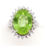 Peridot and silver halo ring