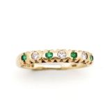 Emerald and diamond set 9ct yellow gold ring
