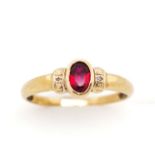 Synthetic red gemstone and 9ct yellow gold ring