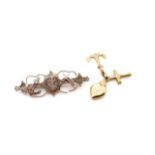 Victorian 9ct rose brooch and a gold charm