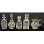 Four crystal decanters & a Scottish crystal jug