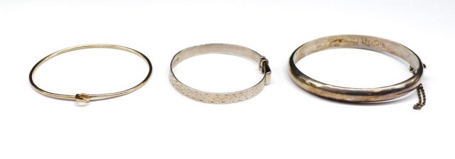 Two silver bangles and a plate example