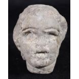 Carved Roman stone head